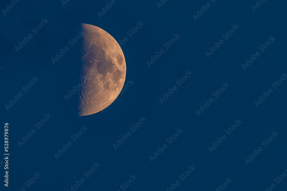 Moon in the night sky with visible craters. Moon in the night sky with visible craters.