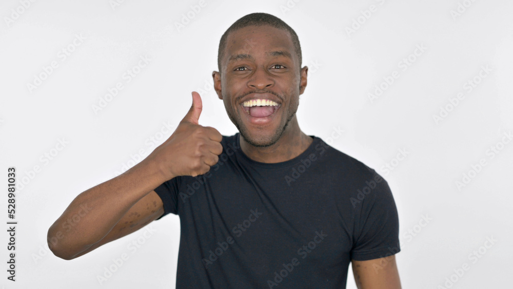 Thumbs Up by Young African Man on White Background Thumbs Up by Young African Man on White Background