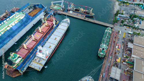 cargo container ship at dry dock concept maintenance service working in the sea. Insurance and Maintenance Cargo Ship concept. Freight Forwarding Service maintenance Insurance