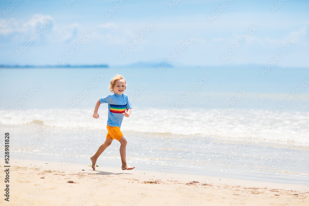 Kids playing on beach. Children play at sea. Kids playing on beach. Children play at sea.