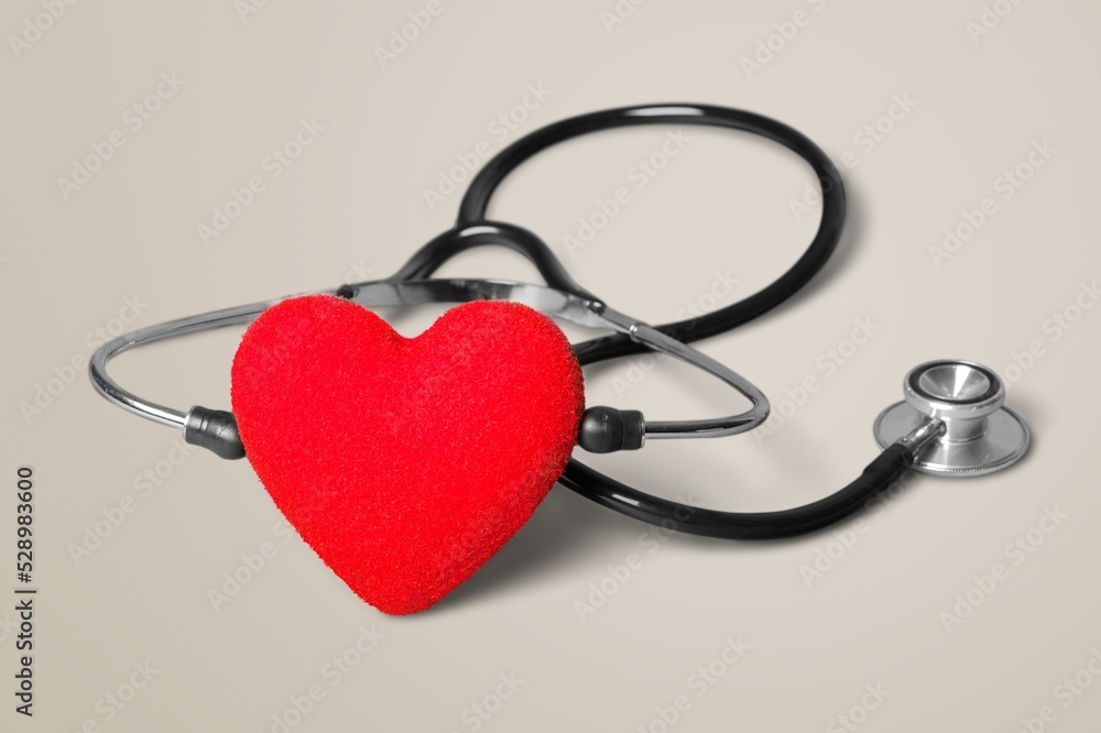Near the stethoscope lies a heart on the desk Near the stethoscope lies a heart on the desk
