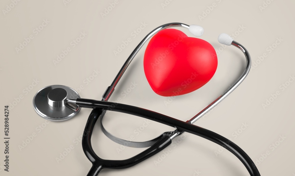 Near the stethoscope lies a heart on the desk Near the stethoscope lies a heart on the desk