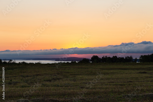 Series of small islands in the St. Lawrence River seen at sunrise from Saint-Fran  ois village in the Island of Orleans during a late summer sunrise  Quebec  Canada