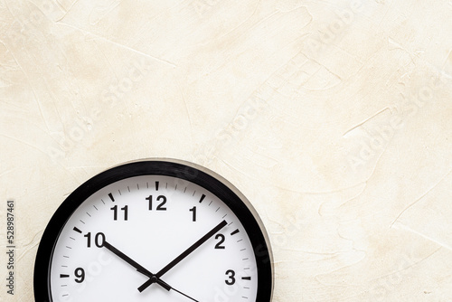 Black and white clock. Round wall clock - time to work concept