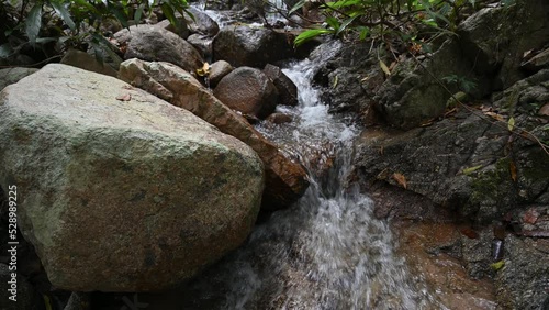 water flow on Tat Moel Waterfall at khuntan mountain national park.the Khun Than mountain range of the DoiKhun national park natural boundary between the northern Lamphun Lampang.
 photo