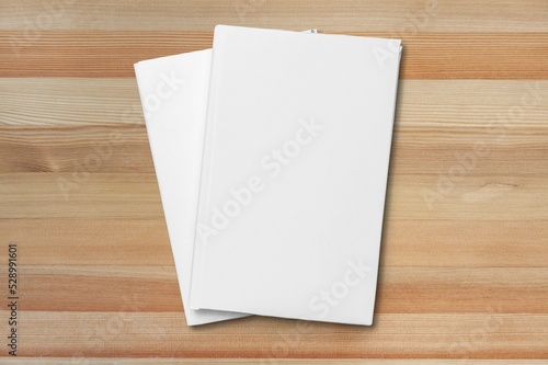 Blank open paper on wooden table, top view
