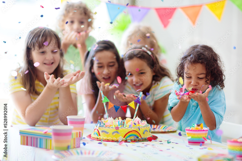 Fototapeta premium Kids birthday party. Children with cake and gifts