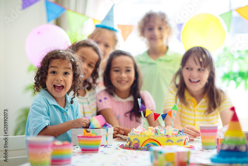 Kids birthday party. Children with cake and gifts