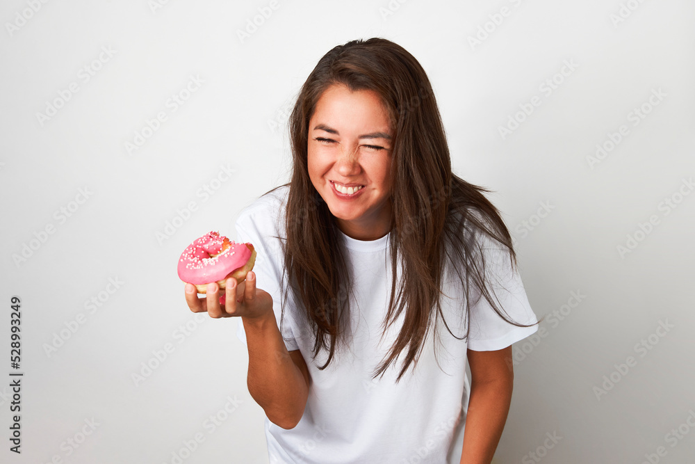 Woman with red donut on white background Woman with red donut on white background