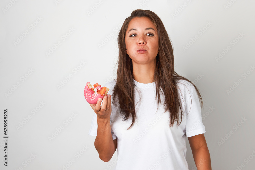 Woman with red donut on white background Woman with red donut on white background
