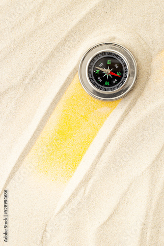 Obraz na płótnie Compass in the sand. Best solution or direction concept