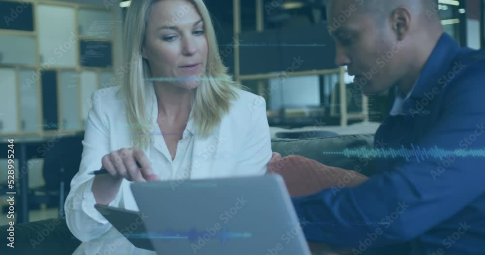 Animation of data processing over diverse business people at office Animation of data processing over diverse business people at office