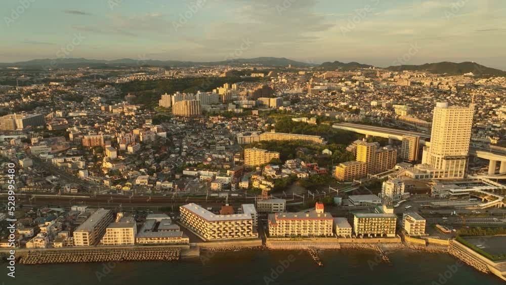 custom made wallpaper toronto digitalAerial view of sprawling coastal town on rolling hills in late afternoon sun