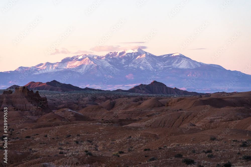 Snowy mountain behind rock formations Snowy mountain behind rock formations