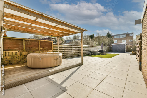Backyard of a house with transparent roof and portable pool