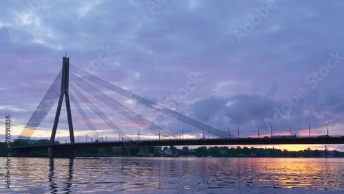 Vansu bridge, Riga, Latvia. Midlle shot, blue orange sunset. photo