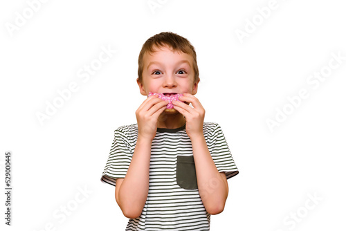 happy boy eating donut in pink glaze isolate on white background