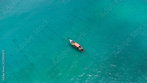 Photo in paradise island. Aerial photography of a boat in crystal clear waters. Phi Phi Island in Thailand. Paradise Beach. drone photography