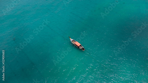 Photo in paradise island. Aerial photography of a boat in crystal clear waters. Phi Phi Island in Thailand. Paradise Beach. drone photography © TxemaPhoto
