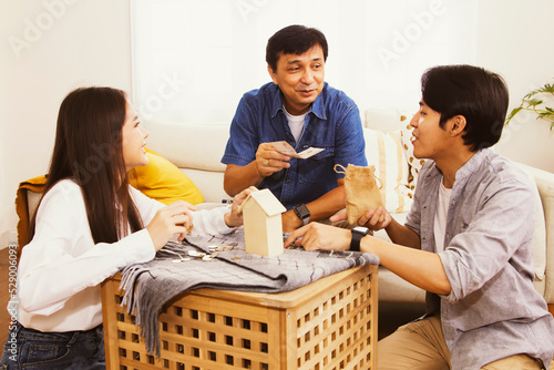 Fathers convene to encourage sons and daughters to save their cash and coins in order to plan security and insure the success of their children's lives : Plan your family savings for the future.