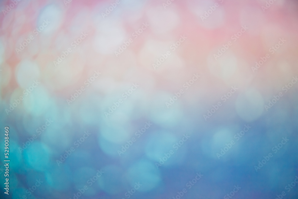 Bokeh light. Blur glow. Rainbow overlay. Round flecks texture. Defocused orange blue circles flare on color gradient abstract copy space background. Bokeh light. Blur glow. Rainbow overlay. Round flecks texture. Defocused orange blue circles flare on color gradient abstract copy space background.