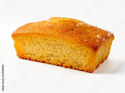 Fototapeta Madiera vanilla  loaf tin cake isolated on a white background