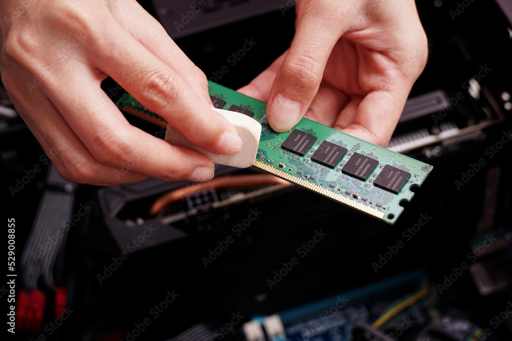 Cleaning a random access memory or RAM using an eraser.
Cleaning a random access memory or RAM using an eraser.