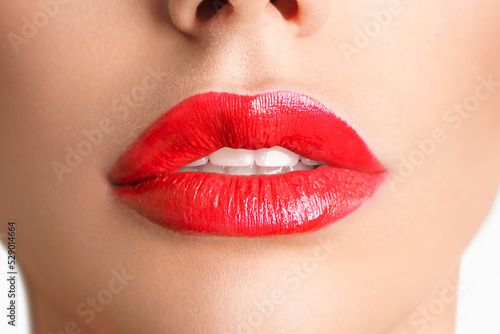 Close-up Beautiful lips. Sexy plump lips which red lipstick.