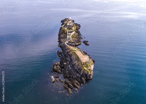 Aerial of the Rotten Island Lighthouse with Killybegs in background - County Donegal - Ireland