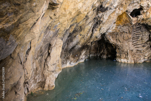 Sinkhole Lake with blue water and rocky walls in Pyatigorsk russia