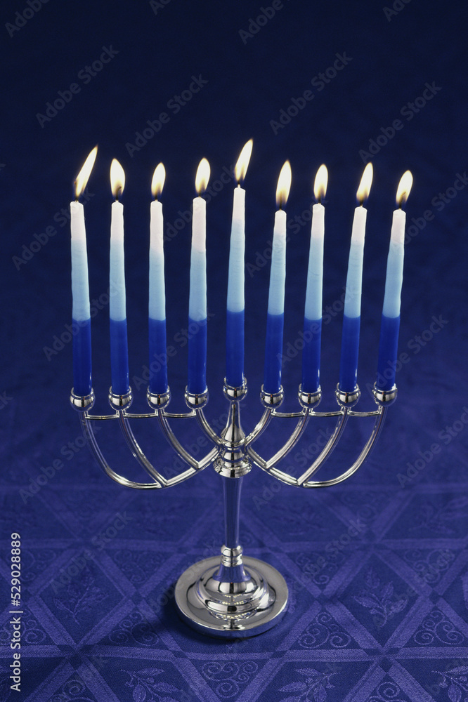 Lit candles on a menorah Stock Photo Adobe Stock