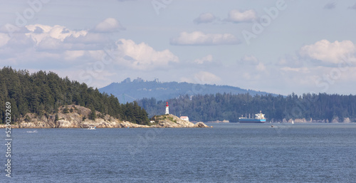 Lighthouse Park, Modern city in background during sunny summer day. West Vancouver, British Columbia, Canada. © edb3_16