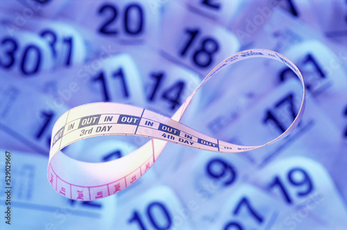 Close-up of a calendar on a strip of paper