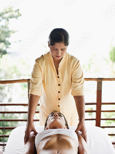 Woman Receiving Marma Point Therapy.  Koh Samui, Thailand.
