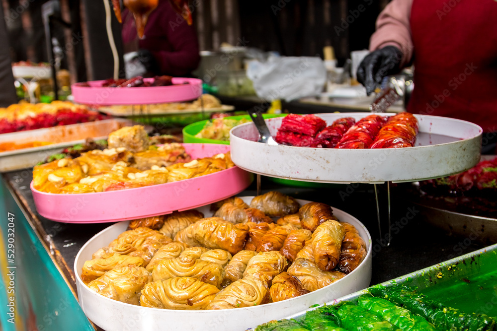 Obraz premium Plate with sweets. Table setting, food, holiday, birthday preparation. Oriental sweets, Turkish sweets
