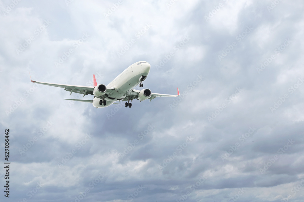Airplane flying high in cloudy sky. Modern aircraft Airplane flying high in cloudy sky. Modern aircraft
