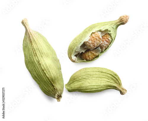 Dry green cardamom pods on white background, top view