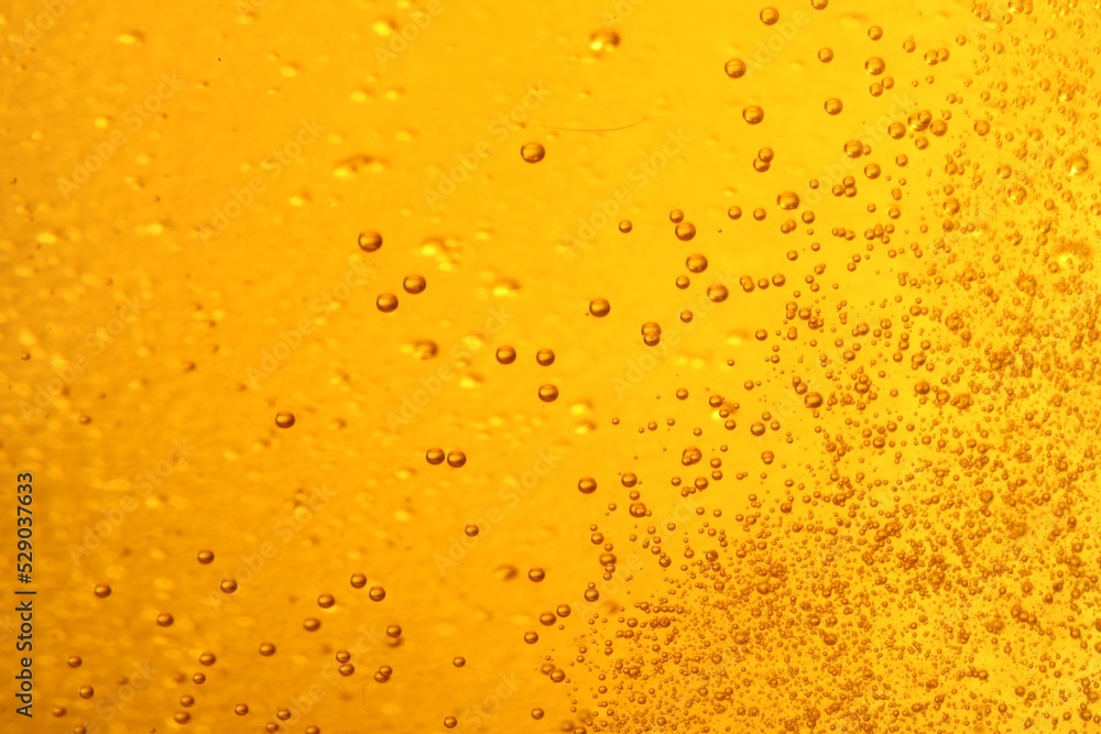 Tasty beer with bubbles as background, closeup Tasty beer with bubbles as background, closeup