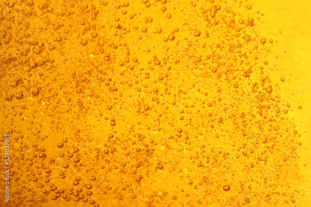 Tasty beer with bubbles as background, closeup Tasty beer with bubbles as background, closeup