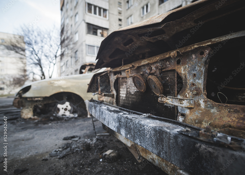 Cars burned to the skeleton after shelling by rocket artillery in a residential area in Ukraine during a military escalation of hostilities and armed military aggression