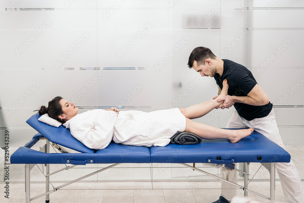 Fototapeta premium Man Working in Physiotherapy Clinic