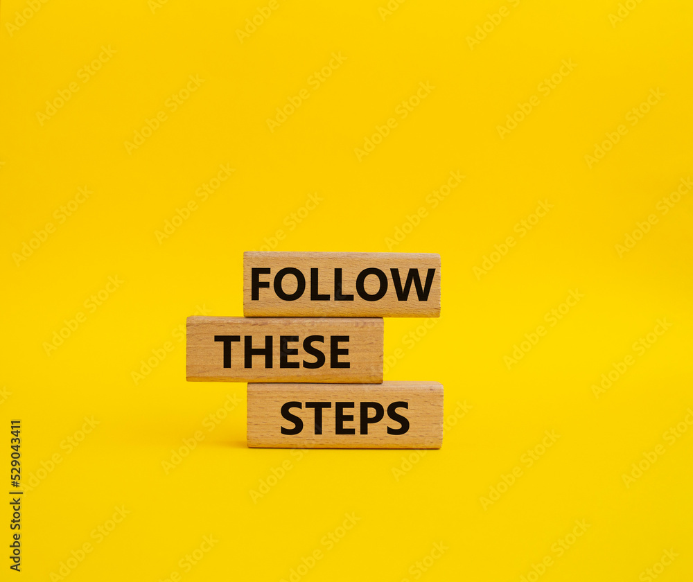 Follow these steps symbol. Wooden blocks with words Follow these steps. Beautiful yellow background. Business and Follow these steps concept. Copy space. Follow these steps symbol. Wooden blocks with words Follow these steps. Beautiful yellow background. Business and Follow these steps concept. Copy space.