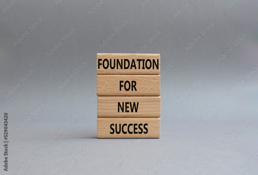 Foundation for new success symbol. Wooden blocks with words Foundation for new success. Beautiful grey background. Business and Foundation for new success concept. Copy space. Foundation for new success symbol. Wooden blocks with words Foundation for new success. Beautiful grey background. Business and Foundation for new success concept. Copy space.