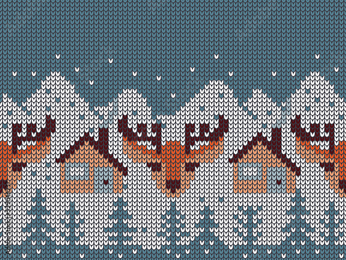 Knitted ornament with deer head, houses, trees and snowy mountains.Vector seamless pattern in blue, white, beige and orange colors.Norway knitwear sweater design for printing on fabric and paper.
