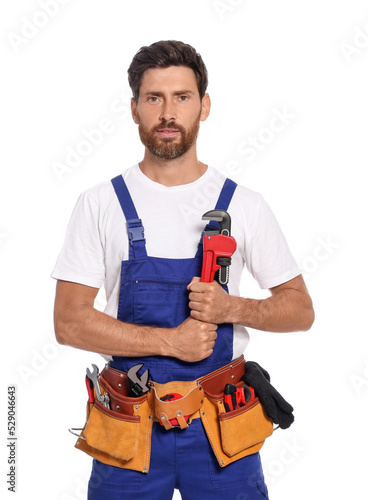 Professional plumber with pipe wrench and tool belt on white background