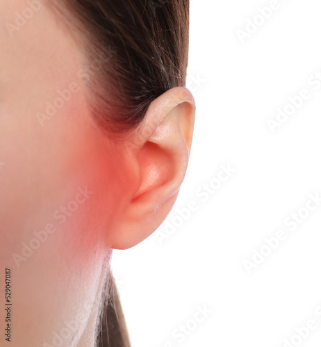 Woman suffering from ear pain on white background, closeup
