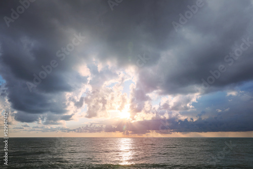 Picturesque view of sky with heavy rainy clouds over sea