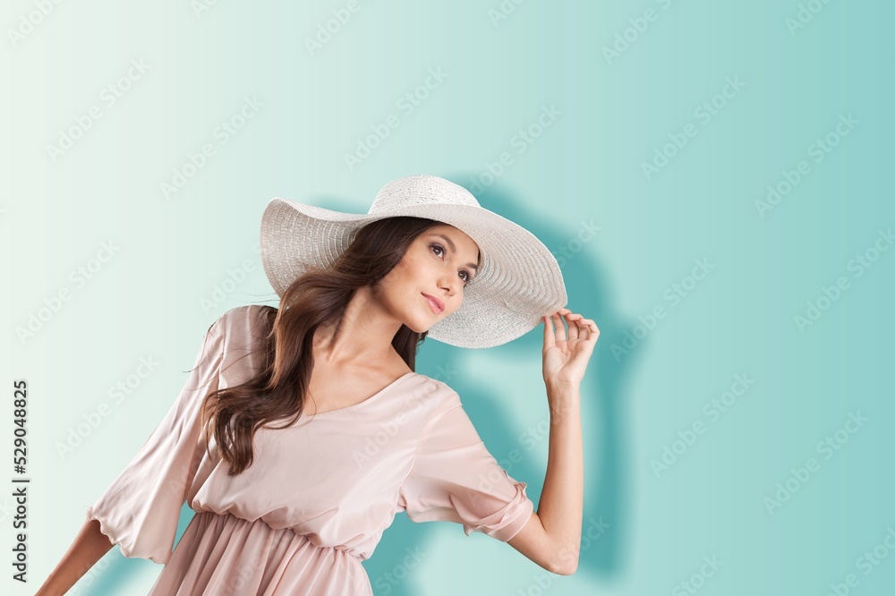 Portrait of young woman in resort fashion on background Portrait of young woman in resort fashion on background