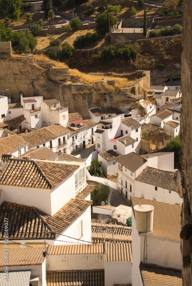Beautiful panoramic view of Setenil de las Bodegas white houses on a sunny day. Andalusia, spain