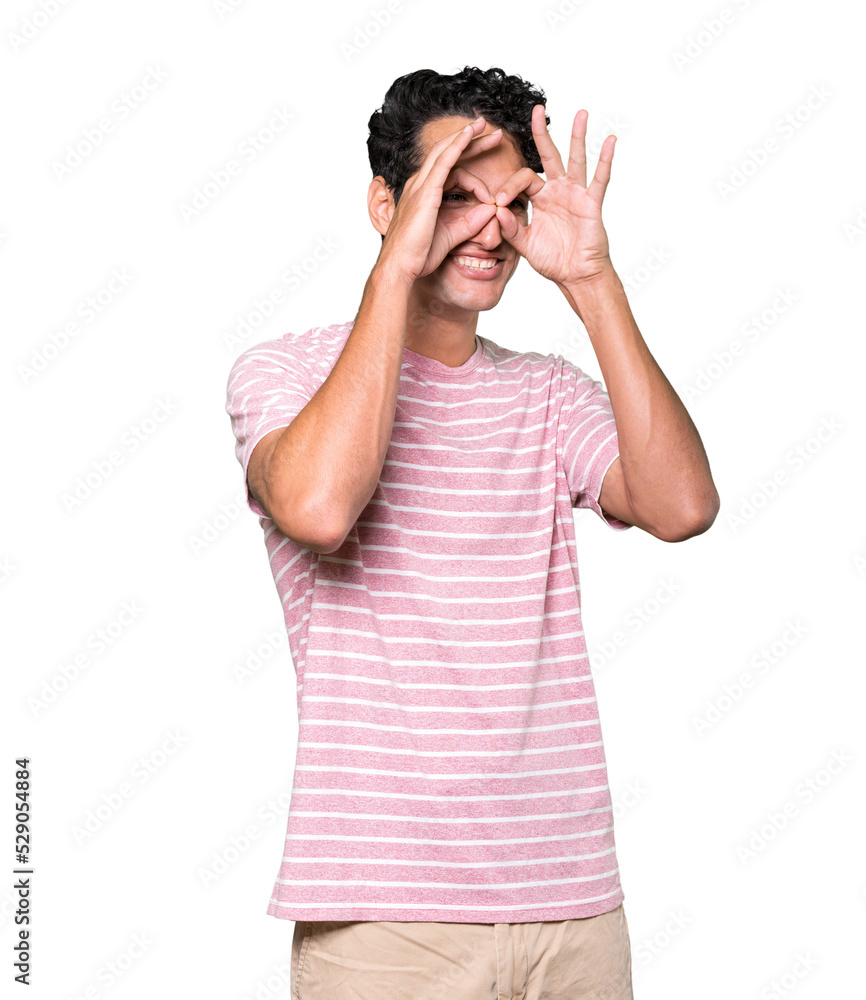 Amazed young man using his hands like a binoculars Amazed young man using his hands like a binoculars